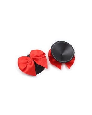 Paire de cache tétons adhésifs noir avec nœud papillon rouge 